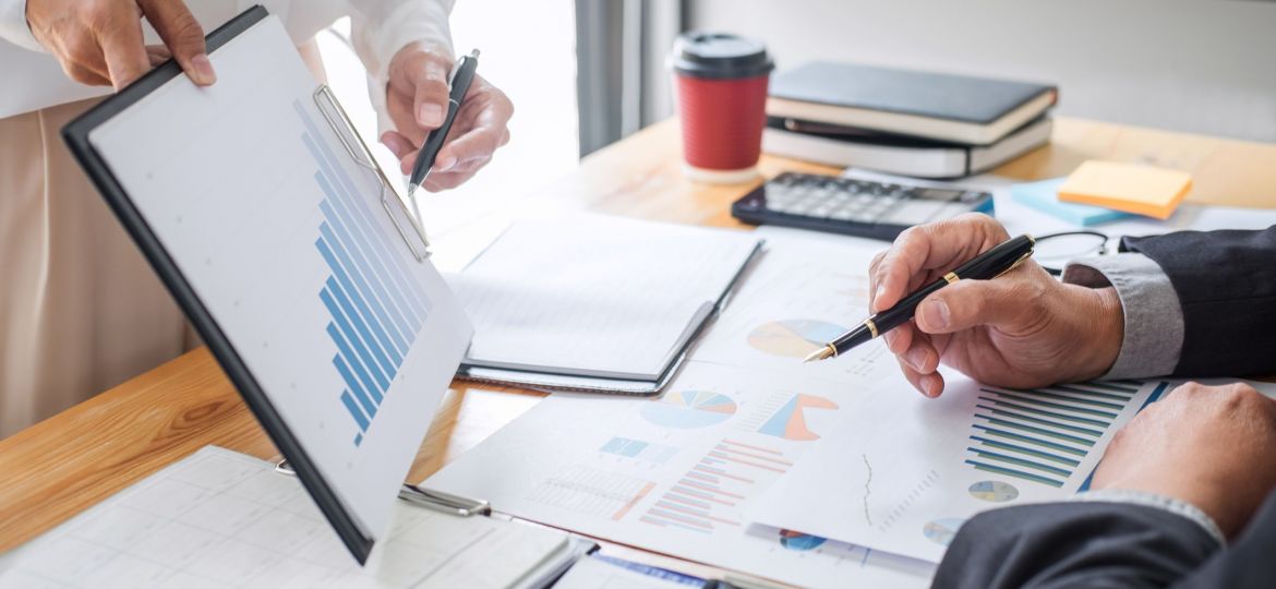 business-professionals-reviewing-charts-and-graphs-2026-01-11-08-39-28-utc